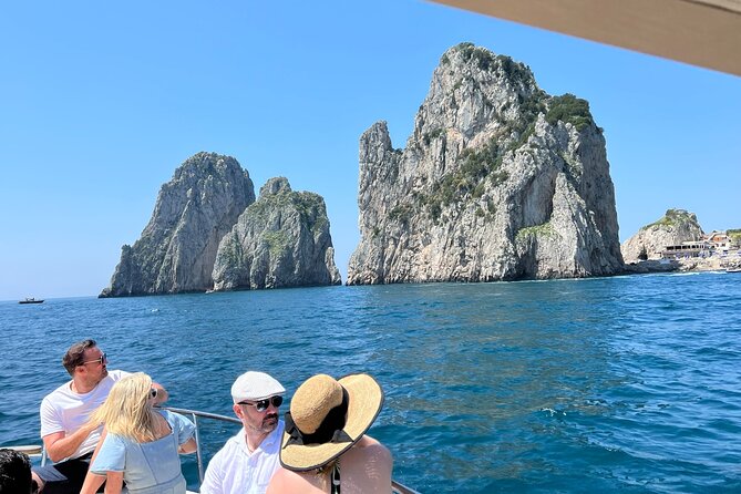 Capri, Blue Grotto by Priority, Faraglioni Swim and City Visit - Malaparte Villa, Tiberius’ Leap, and the Scugnizzo statue from the water
