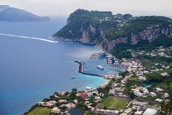 Capri Premium Private Boat Tour + City Visit - Capri coast highlights: beaches, Roman baths, and Punta Carena at sunset
