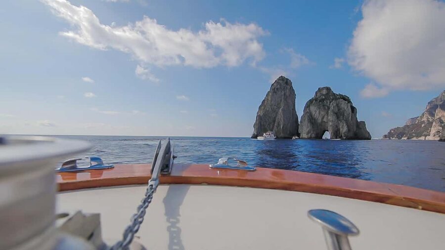 From Positano: Day trip to Capri - Group Tour by boat - Capri from the water: Faraglioni, natural arches, and the grotto circuit