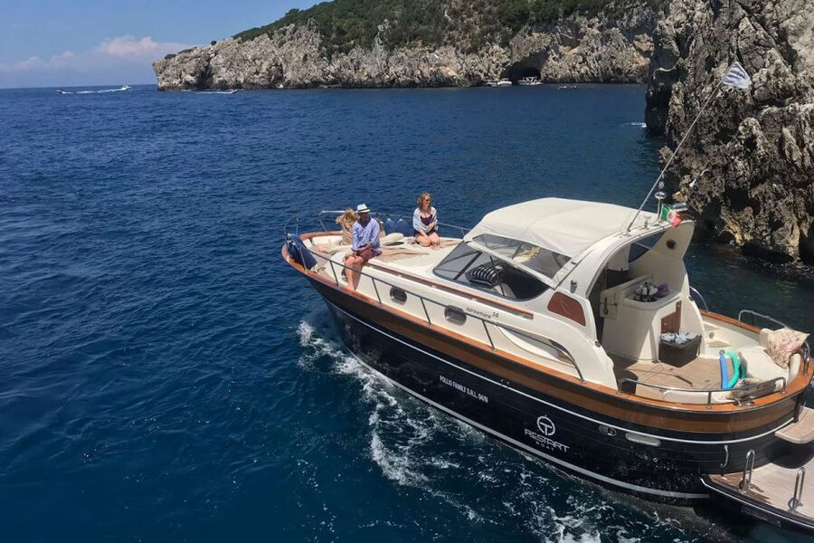 Positano: Boat Tour of Capri with Drinks and Snacks - Capri from the water: grottos, Faraglioni, and the Li Galli legend