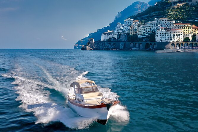 Private Amalfi Coast Sunset Boat Tour - Drinks and aperitif snacks: the free bar is part of the show