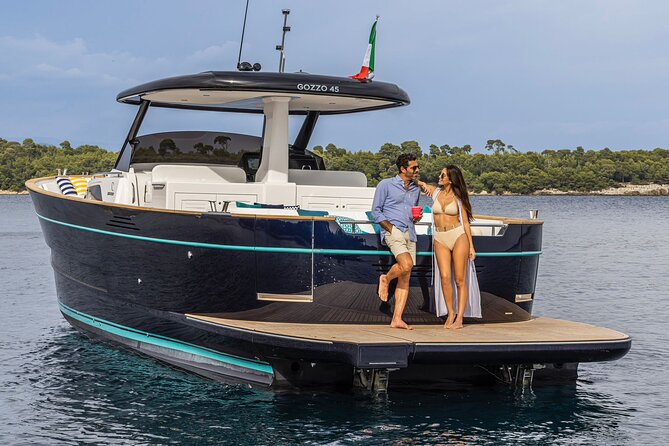 Private Full Day Capri Tour by Boat from Positano - Capri circumnavigation: Faraglioni rocks and Punta Carena lighthouse views